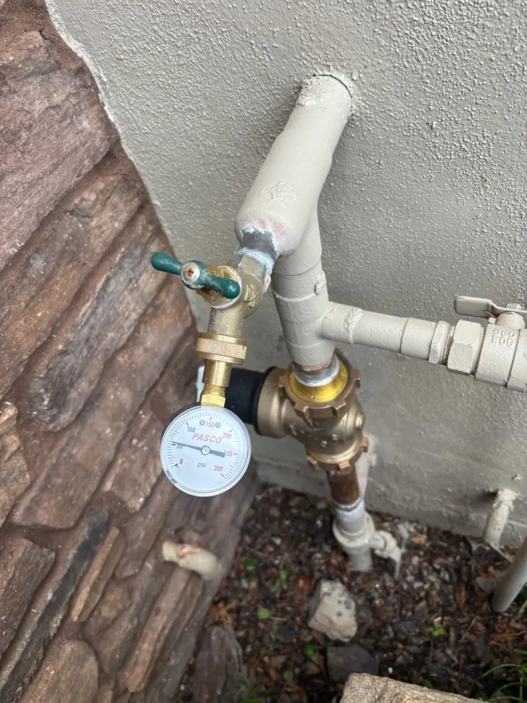 Water pressure checked with a gauge after installing a new regulator